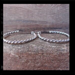 Sterling silver hoop earrings by Tahe